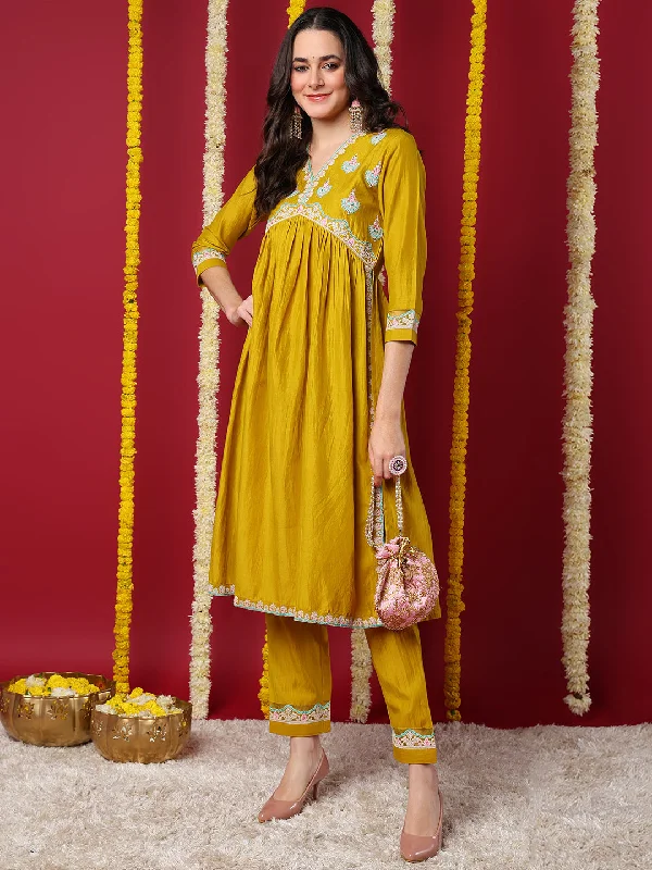 Yellow Silk Blend Solid Embroidered Flared Kurta with Trouser High Waist Slim Fit Ankle Length Yellow Silk Blend Solid Embroidered Flared Kurta with Trouser High Waist Slim Fit Ankle Length